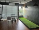 Modern office with desk, chair, and large window with blinds.