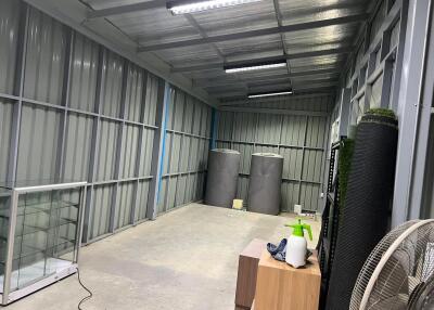 Clean and organized storage area with metal walls and ceiling