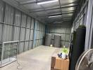 Clean and organized storage area with metal walls and ceiling