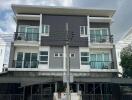 Exterior view of a multi-story residential building with balconies