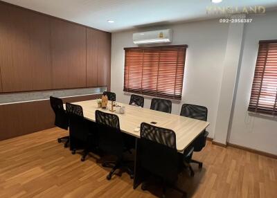 Meeting room with wooden table and chairs