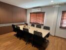 Meeting room with wooden table and chairs