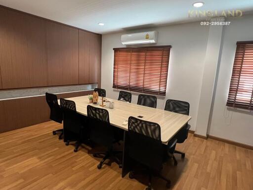 Meeting room with wooden table and chairs