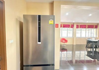 Modern kitchen with large stainless steel refrigerator