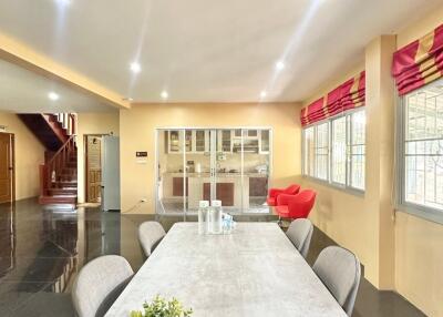 Spacious dining area with modern decor and natural lighting