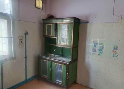 Small kitchen area with vintage cabinet and sink