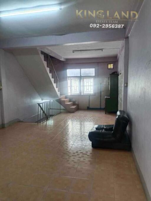 Spacious living room with staircase