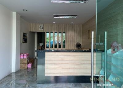 Office reception area with a desk and glass door