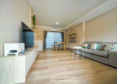 Spacious and modern living room with dining area