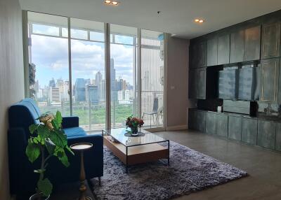 Modern living room with a large window and city view