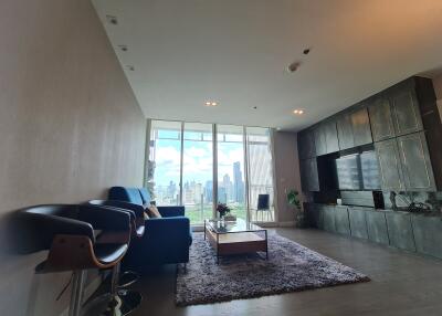 Modern living room with large windows and city view