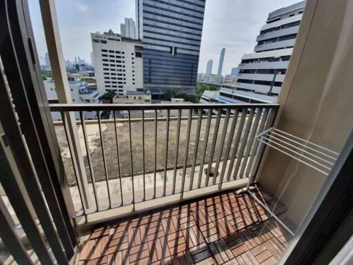 Balcony view of cityscape with high-rise buildings