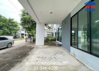 Building exterior with driveway and large windows