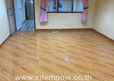 Empty room with tiled floor and curtain windows