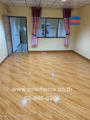 Empty room with tiled floor and curtain windows