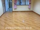 Empty room with tiled floor and curtain windows