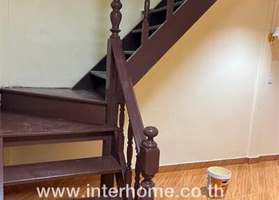 Wooden staircase with brown steps and banister