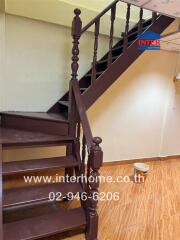 Wooden staircase with brown steps and banister