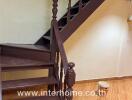 Wooden staircase with brown steps and banister