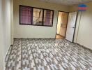 Main living space with tiled flooring and window