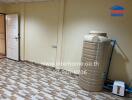 Utility room with water tank and tiled flooring