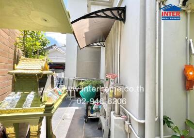 Exterior area with a washing machine and small shrine