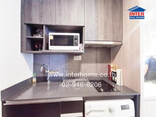 Modern kitchenette with built-in appliances