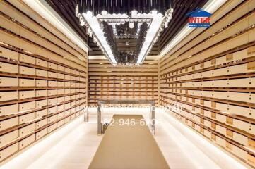 Spacious and organized storage room with well-lit shelving