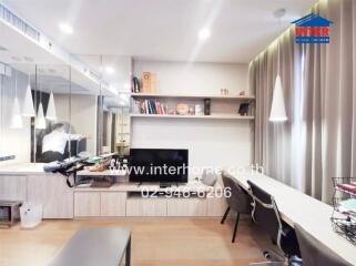 Modern living room with desk and bookshelves