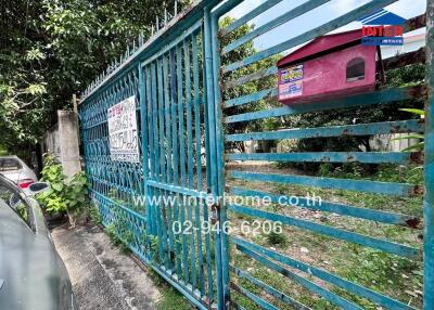 Gated entrance with contact information