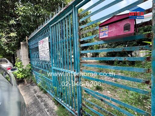 Gated entrance with contact information