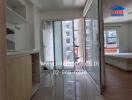 Photo of a bedroom with glass sliding doors, natural light, and adjacent balcony.