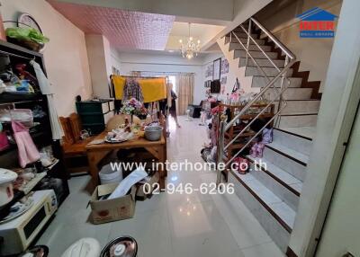 Living area with dining table and staircase