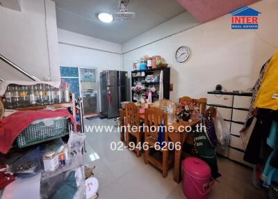 Small kitchen and dining area with dining table, refrigerator, and appliances