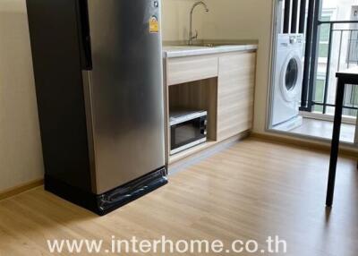 Modern kitchen with refrigerator and washing machine