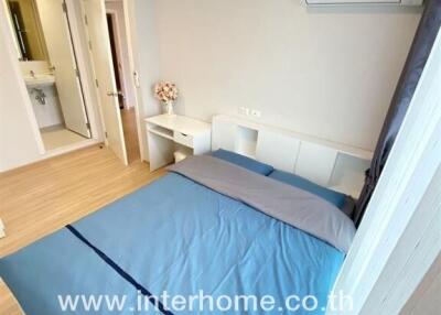 Modern bedroom with double bed, air conditioning, and en-suite bathroom