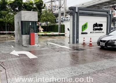 Entrance of a residential complex with security booth