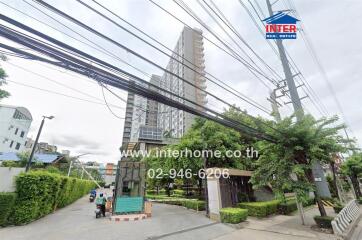 Exterior view of a residential building with a guardhouse