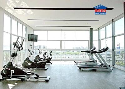 Spacious, well-lit gym with modern equipment