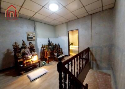 Room with religious artifacts and stairway