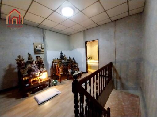 Room with religious artifacts and stairway