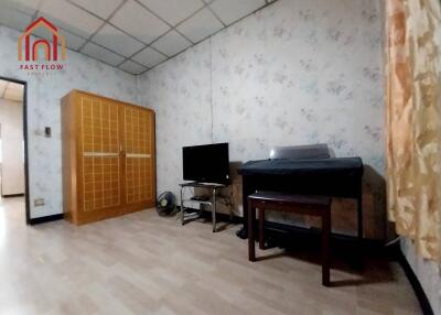 Spacious bedroom with wardrobe and TV