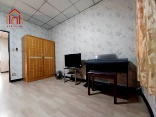 Spacious bedroom with wardrobe and TV