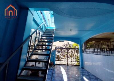 Entrance to the building with stairs and gate