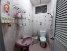 Bathroom with pink sink and toilet