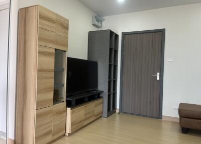 Living room with wooden furniture and TV