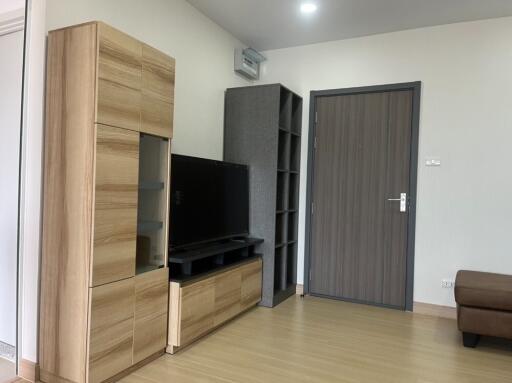 Living room with wooden furniture and TV