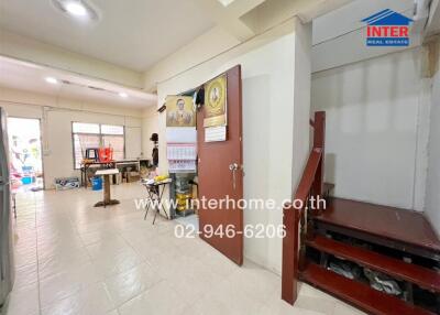 Main living area with staircase and workspace