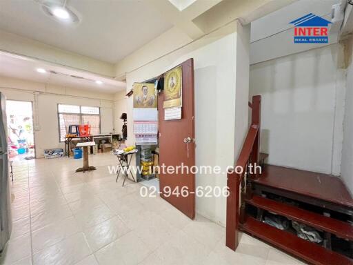 Main living area with staircase and workspace