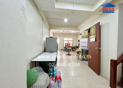 Interior space with table, refrigerator and other miscellaneous items